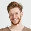 Smiling man headshot on white background