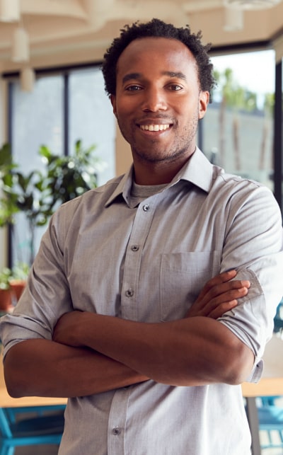 Man in white shirt smiling at camera